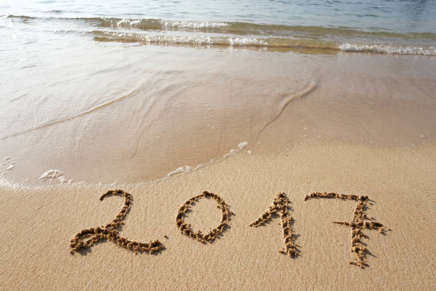 istock Happy New Year 2017 on the beach 653707790