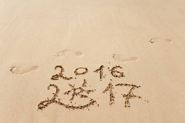 istock Happy New Year 2017 on the beach 653708710
