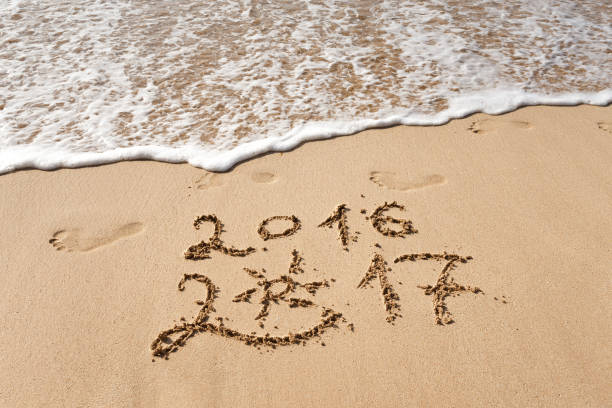 istock Happy New Year 2017 on the beach 653708716