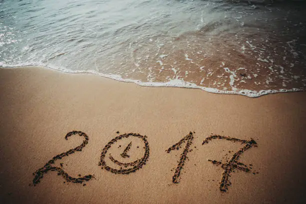 Happy New Year 2017 replace 2016, lettering on the beach
