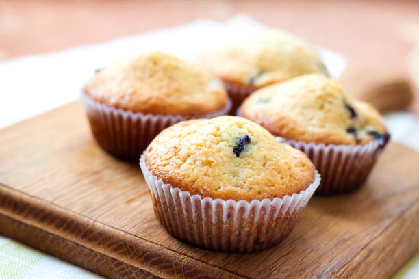 istock Homemade muffins with blueberries on a wooden board 653753228