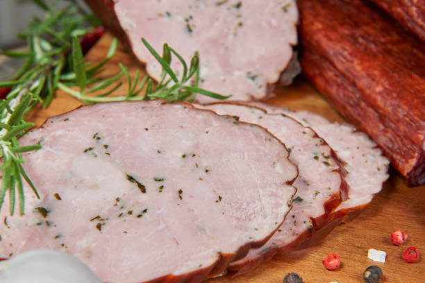 istock Sausage with wild garlic on a wooden board 653753246