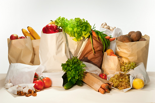 Healthy eating. Fresh vegetables and fruits in paper bags.