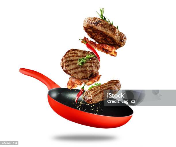 Beef Milled Meat Flying From A Pan On White Background Stock Photo - Download Image Now