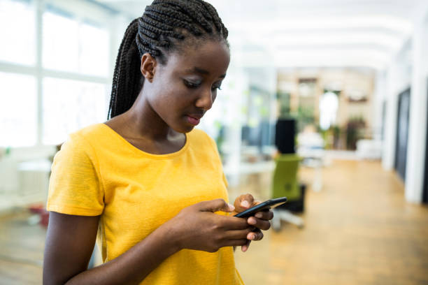 istock Woman text messaging on mobile phone 653762194