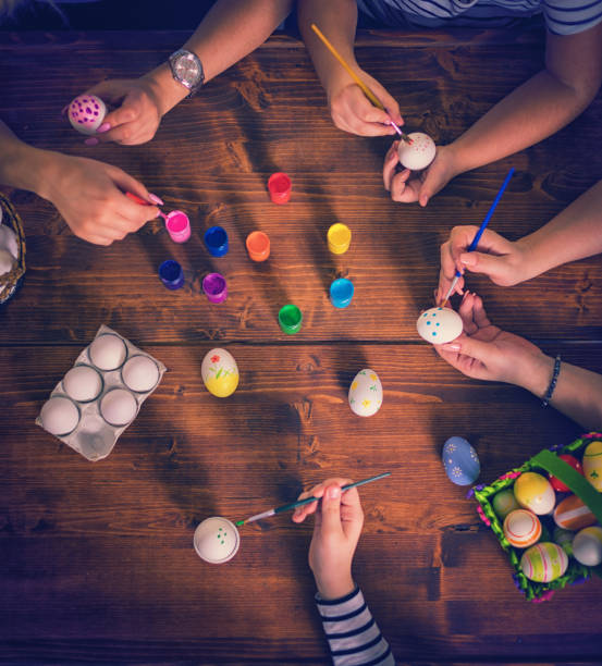 istock Young Family Painting Easter Eggs 653762226