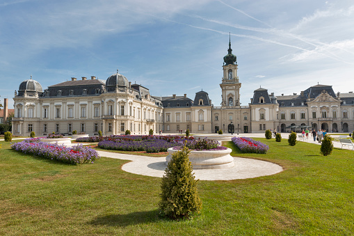 Unrecognized people visit Festetics Palace. The building now houses the Helikon Palace Museum. Keszthely is located on the western shore of Lake Balaton.