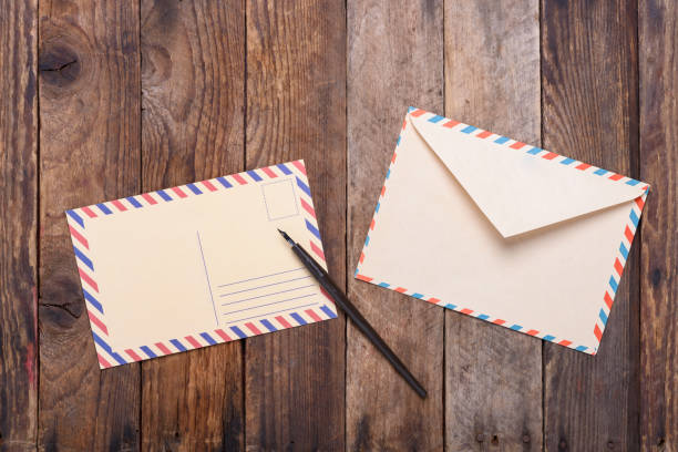 istock Postcard with fountain pen end envelope 653763650