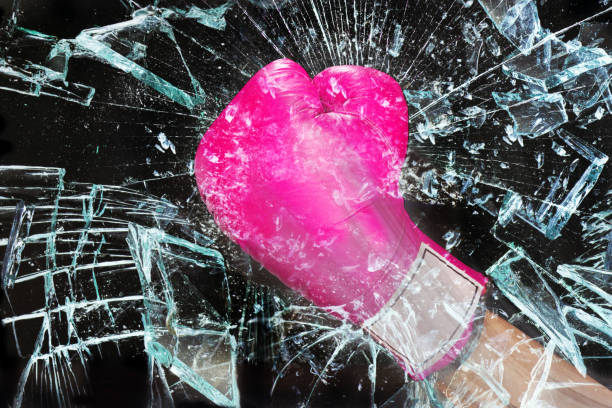 Pink Power. Pink girl power breaking the glass ceiling.. glass punch stock pictures, royalty-free photos & images