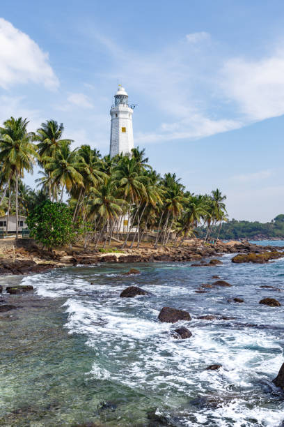 istock Beautiful lighthouse, landscape tropical rocky beach. 653764046