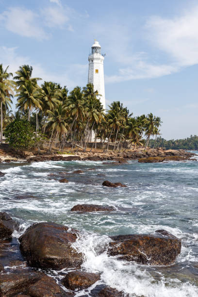 istock Beautiful lighthouse, landscape tropical rocky beach. 653764056