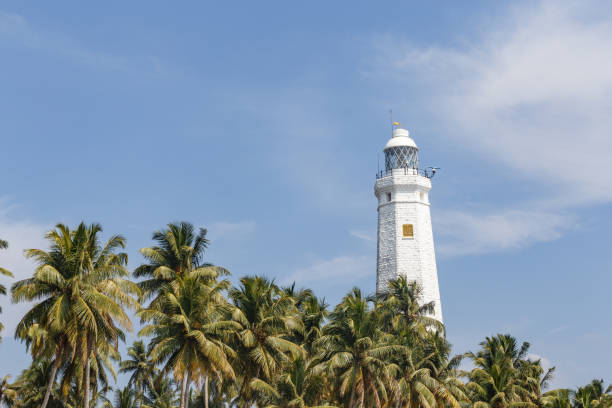 istock Beautiful lighthouse, landscape tropical rocky beach. 653764064