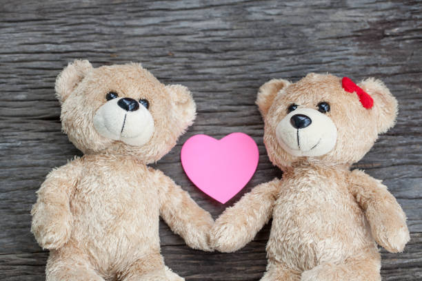 istock teddy bear lying on the wooden floor 653764680