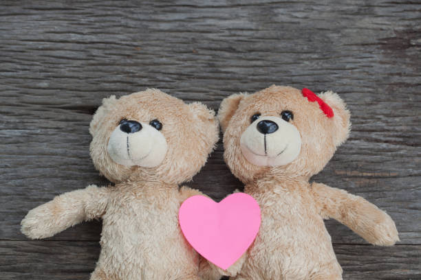 istock teddy bear lying on the wooden floor 653764702