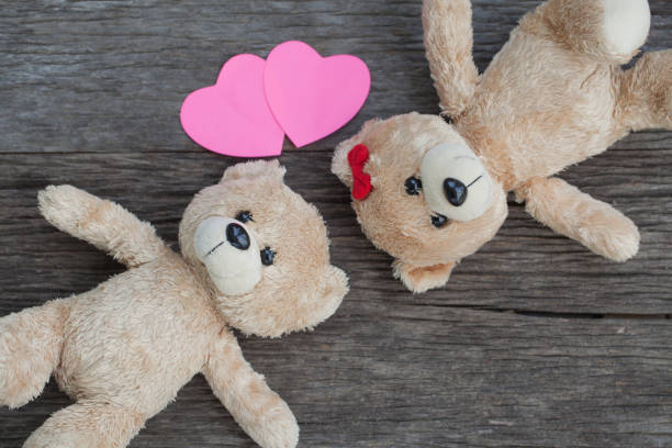 istock teddy bear lying on the wooden floor 653764722
