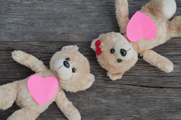 istock teddy bear lying on the wooden floor 653764728