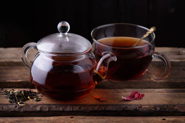 istock Glass teapot and cup with tea 653765022