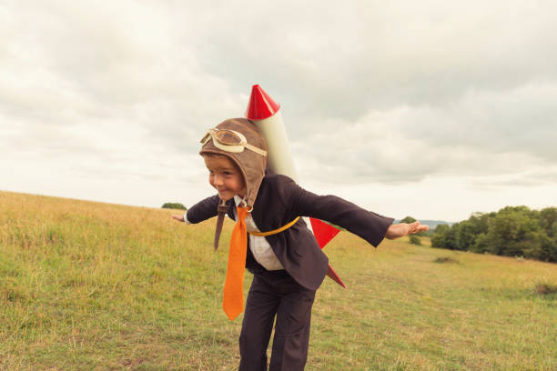 Young Boy Businessman Ready to Launch Rocket