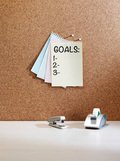 "goals list" reminder note "goals list"reminder note on a memo board stapled paper stock pictures, royalty-free photos & images