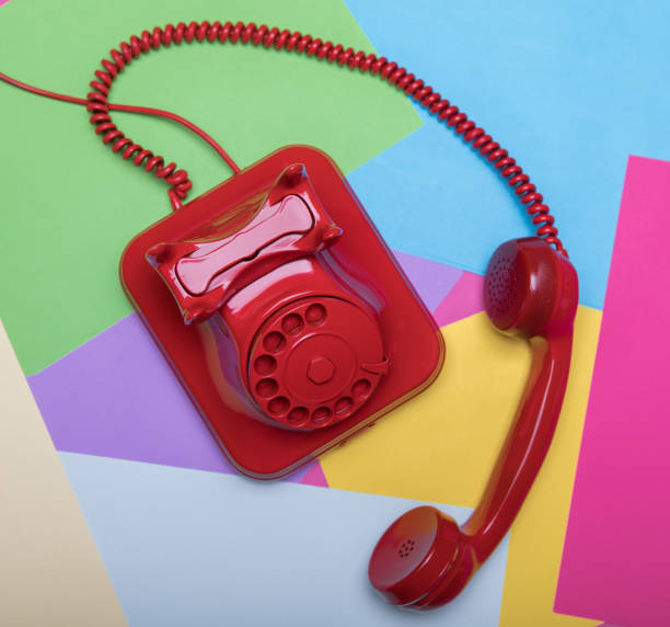 istock Red retro telephone on colorful and pastel background 653769234
