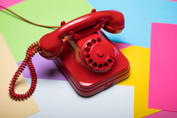 istock Red retro telephone on colorful and pastel background 653769428