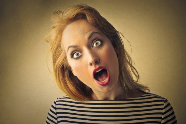 Surprised blond woman with opened mouth