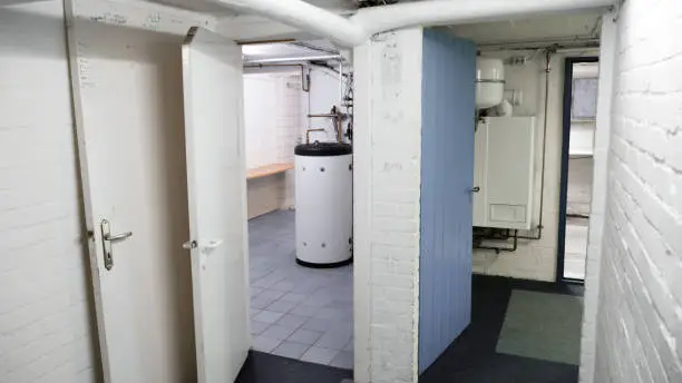 corridor, gas heating unit and garage and empty basement, connected by doors