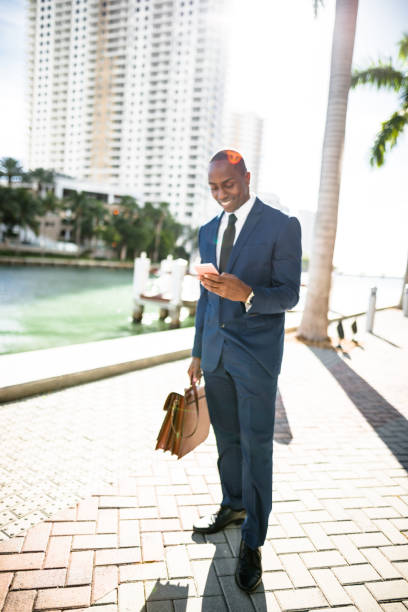 istock businessman make a phone call in miami 653774972