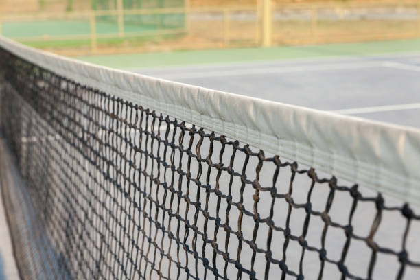 istock tennis net court on sunny day 653775060