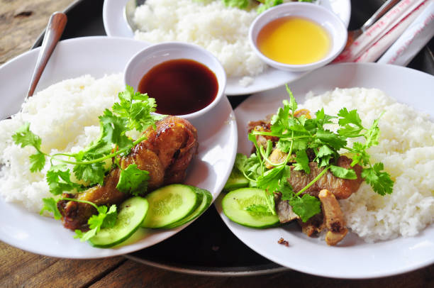 istock Vietnamese broken rice or com tam with fried chicken legs, pork and herbs 653778910