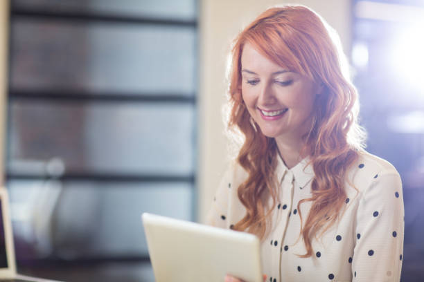 istock Businesswoman using digital tablet in office 653780282