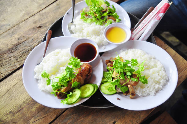istock Vietnamese broken rice or com tam with fried chicken legs, pork and herbs 653780830