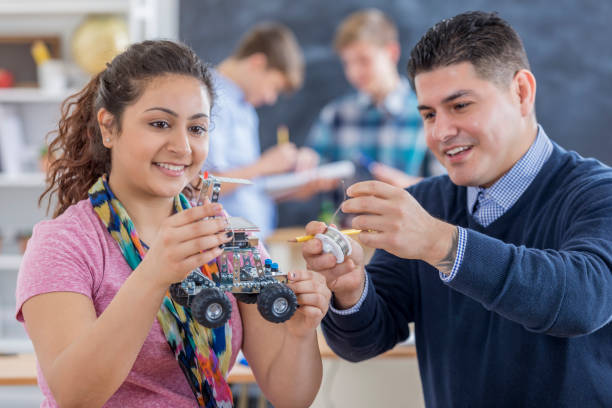 High school teacher helps student build robot