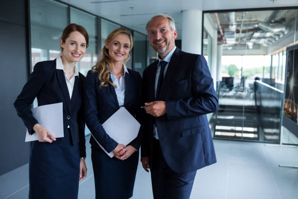 istock Happy businesspeople smiling at the office 653788082