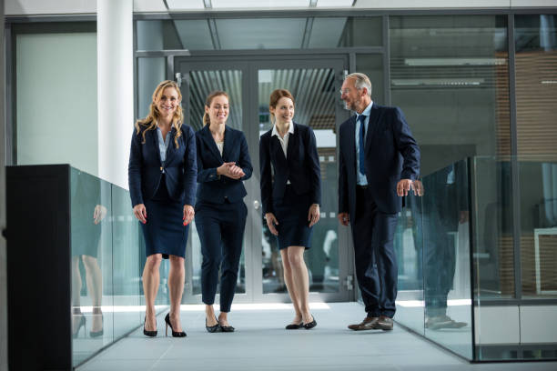 istock Businesspeople standing and having a discussion in office 653794074