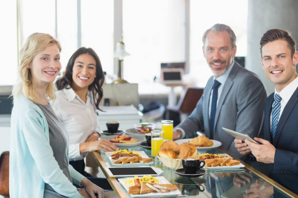 istock Business people having meal in restaurant 653796290