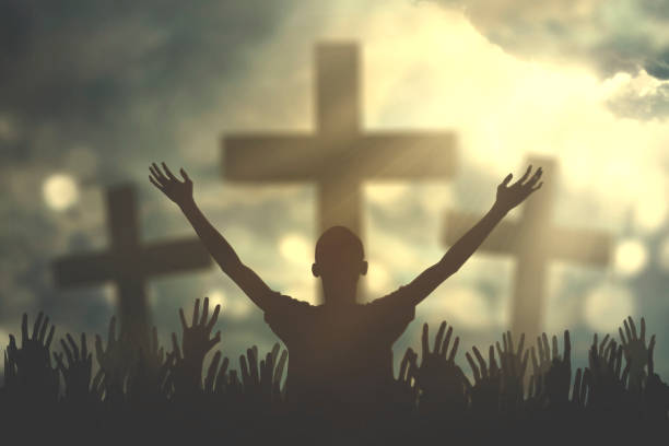 istock Prayers hand with three cross symbols 653800786