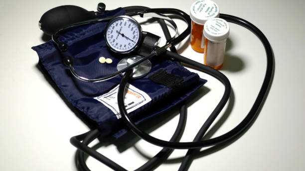 istock Sphygmomanometer and heart medication closeup 653801784