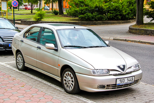 Antalya, Turkey - August 11, 2020: 2018 model white color Alfa Romeo Giulietta is parked at the city street at sunset