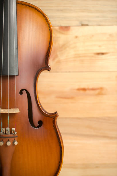 istock Violin on wooden background 653802138