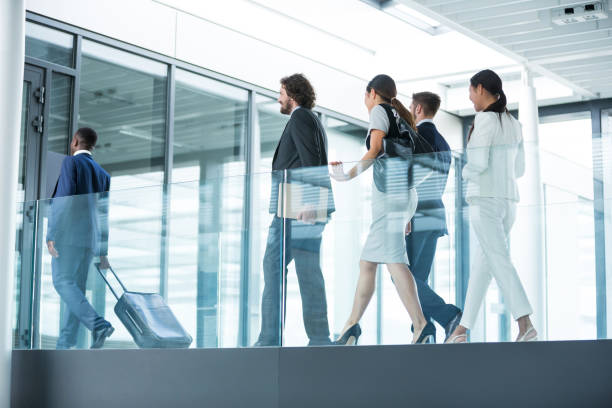 istock Businesspeople walking in office 653802296