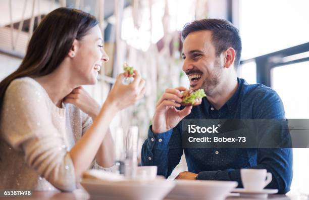 Beautiful Young Couple Sitting In A Cafe Having Breakfast Love Food Lifestyle Stock Photo - Download Image Now