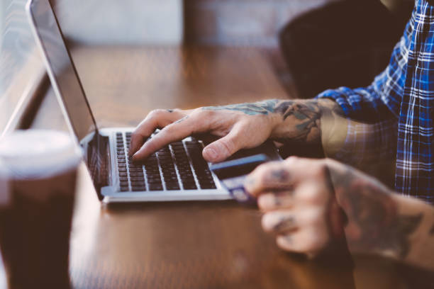 istock Man shopping online with credit card 653813964