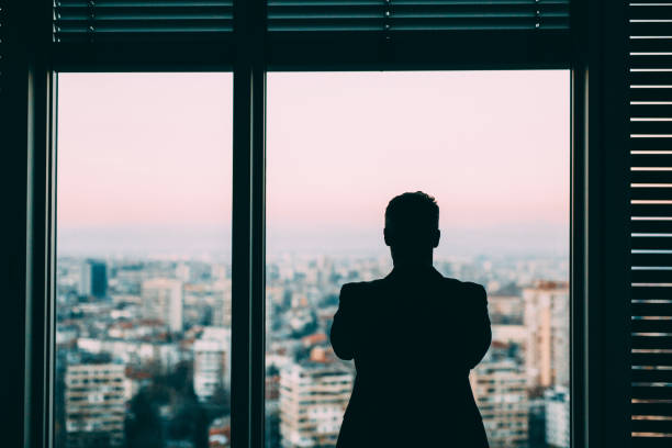 istock Businessman At The Window 653816074