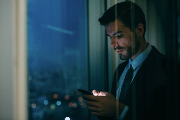 istock Buisnessman Texting On The Phone 653816094