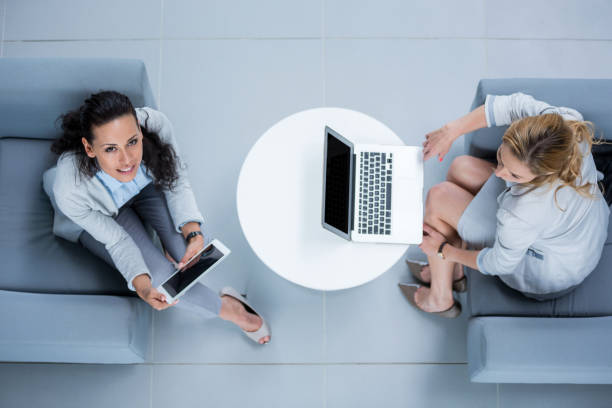 istock Businesswomen using laptop and digital tablet 653816606