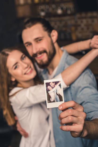 istock Couple with instant photo 653817072