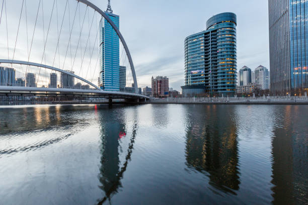 istock River And Modern Buildings Against Sky 653817974