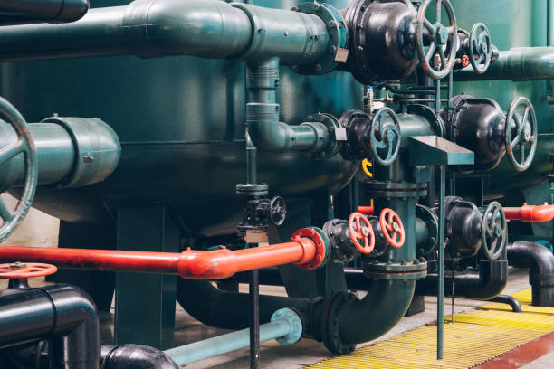 istock steel pipelines and cables in a plant 653819414