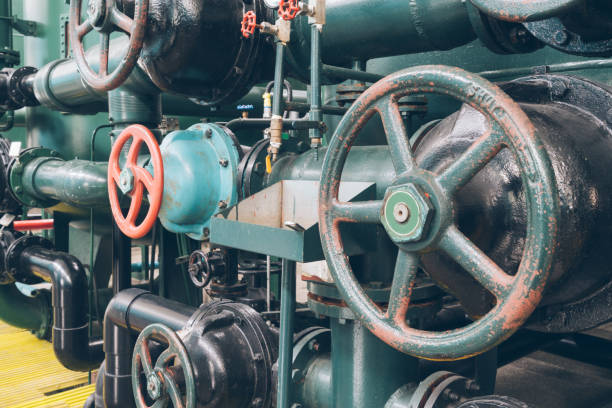 istock steel pipelines and cables in a plant 653819792